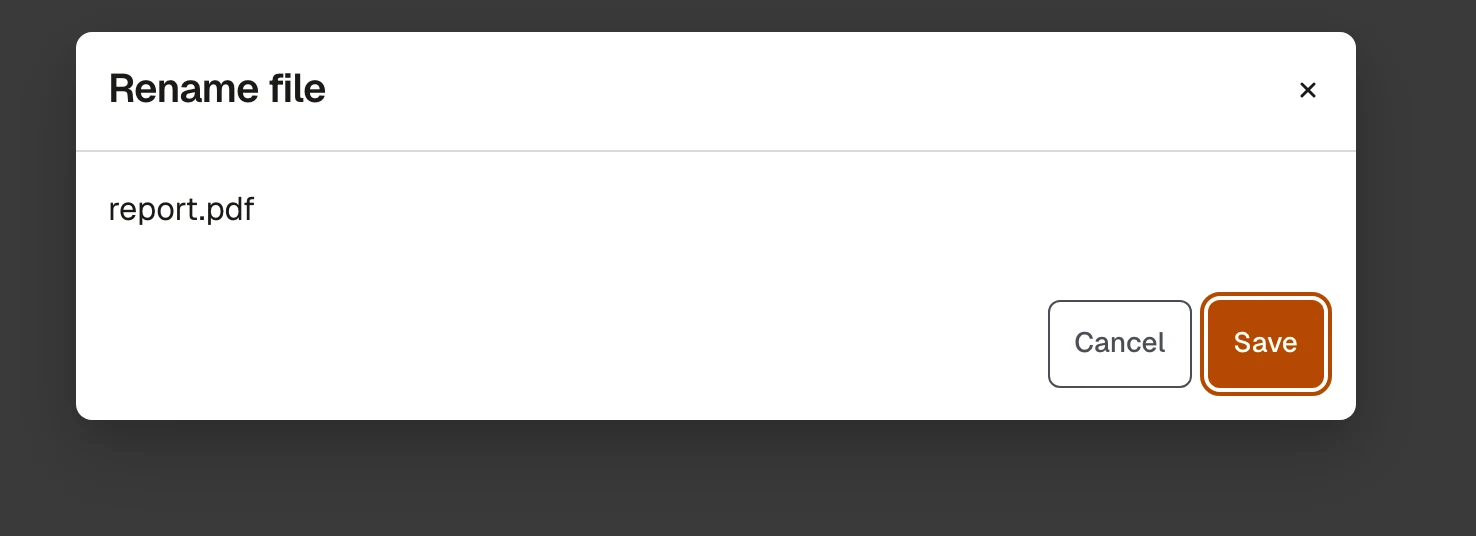 A dialog titled Rename file with a Cancel and a Save button; the Save button has a visible focus ring after Shift+Tab was pressed from the dialog panel.